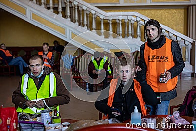 LVIV, UKRAINE -March 14, 2022: Humanitarian crisis during the war in Ukraine. Volunteers have a rest in the volunteer center at Editorial Stock Photo
