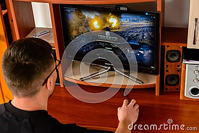 LVIV, UKRAINE - MARCH 08, 2019: Illustration of a computer game World of Tanks, showing a man playing this game Editorial Stock Photo