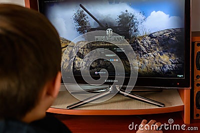 LVIV, UKRAINE - MARCH 08, 2019: Illustration of a computer game World of Tanks, showing a teenager playing this game Editorial Stock Photo