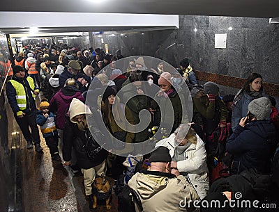 Lviv, Ukraine - March 8, 2022: Refugees near railway station of Lviv waiting for the train to Poland Editorial Stock Photo