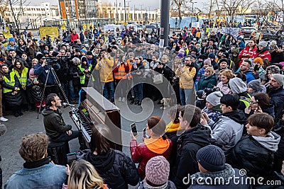 LVIV, UKRAINE - March 12, 2022: Spontaneous concert of the frontman of Okean Elzy Vyacheslav Vakarchuk at the Lviv Railway Station Editorial Stock Photo