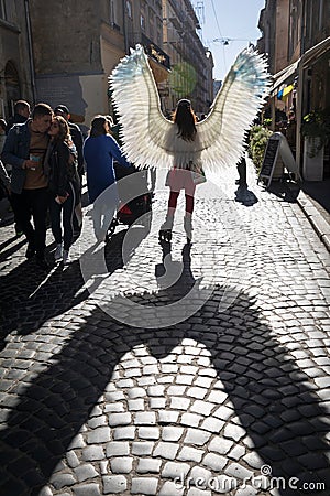 Young girl with angel wings on Lviv streets Editorial Stock Photo