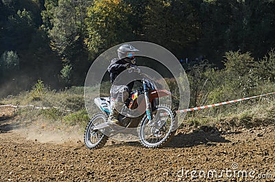 LVIV, UKRAINE - OCTOBER 2021: Athletes motorcycle children racers compete in motocross competition on the race track Editorial Stock Photo