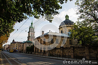 Lviv, Ukraine: Panorama of Pidvalna street with the tall bell tower of Dormition church and the dome of Dominican Church Editorial Stock Photo