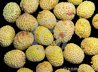 Lychee- small rounded fruit with sweet white scented flesh, a large central stone, and a thin rough skin Stock Photo