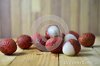 Lychees fruit on wooden background Stock Photo