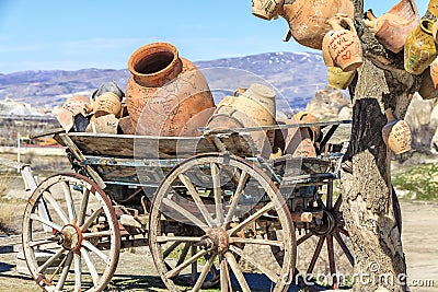 Lying on the cart pots on a background of mountains in Capadocia Stock Photo