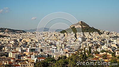 Lykavitos rising above modern Athens Stock Photo