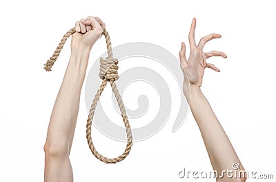 Lynching and suicide theme: man's hand holding a loop of rope for hanging on white isolated background Stock Photo