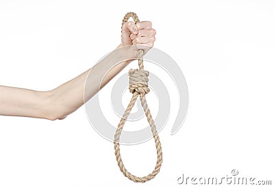 Lynching and suicide theme: man's hand holding a loop of rope for hanging on white isolated background Stock Photo