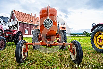 Front logo of a vintage orange Allgaier Porsche tractor.. Editorial Stock Photo