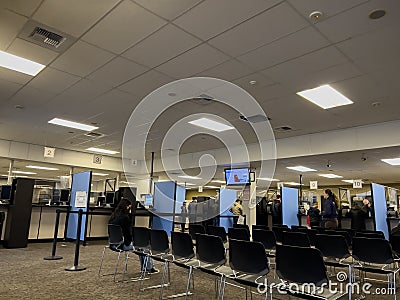 Lynnwood, WA USA - circa November 2022: Wide view of people inside the Lynnwood DMV building, updating and applying for licenses Editorial Stock Photo