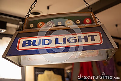 bud light brand logo and text sign on light billiards of American Budweiser us beer poolroom Editorial Stock Photo