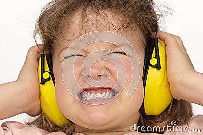 Noise sucks! Child wears hearing protection Stock Photo
