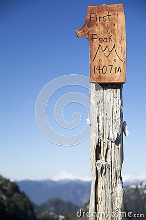 1407m First Peak Sign with Blue Sky on Mtn Seymour North Vancouver, BC Stock Photo