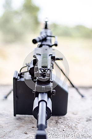 M249 focused on scope minimi light machine gun Stock Photo