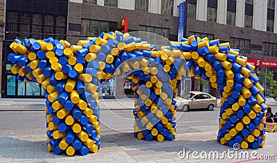 M for Montreal Plastic water buckets sculpture Editorial Stock Photo