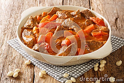 Maafe Beef Stew in peanut sauce close-up in a dish. Horizontal Stock Photo