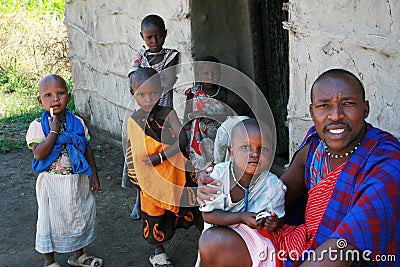 Maasai family in doorway of his home, father and children. Editorial Stock Photo