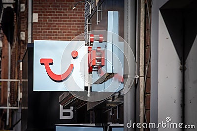 MAASTRICHT, NETHERLANDS - NOVEMBER 10, 2022: Logo of TUI Travel on their local Agency in Maastricht. TUI Group, or Touristik Union Editorial Stock Photo