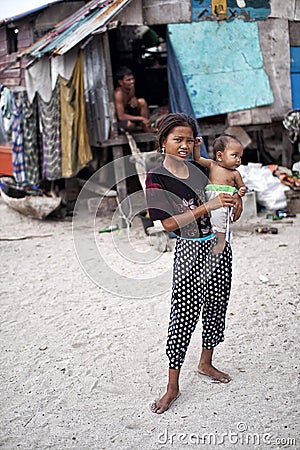 MABUL ISLAND, Sabah. Local kids with his little brother Editorial Stock Photo