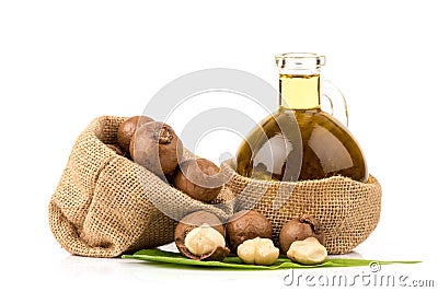 Macadamia fruits and oil isolated white background Stock Photo