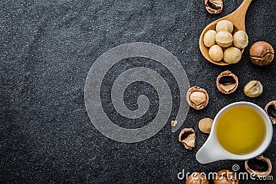 The Macadamia Nut Oil and peeled macadamia nut Stock Photo