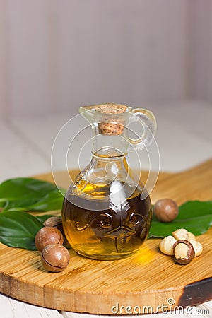 Macadamia oil in a glass bottle. Stock Photo