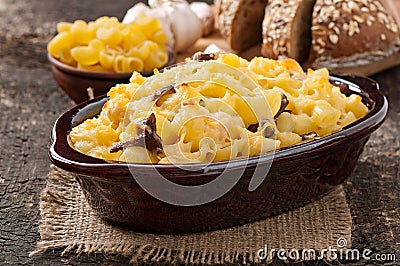 Macaroni with cheese, chicken and mushrooms Stock Photo