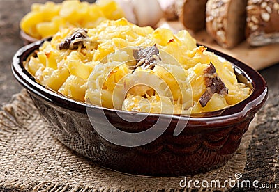 Macaroni with cheese, chicken and mushrooms Stock Photo