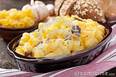 Macaroni with cheese, chicken and mushrooms Stock Photo