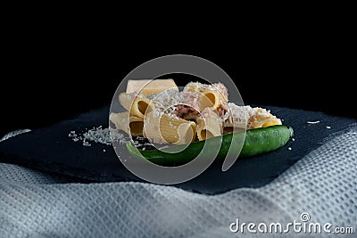 Macaroni with cheese in the foreground, italian pasta Stock Photo