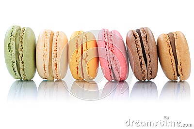 Macarons macaroons cookies dessert from France in a row isolated Stock Photo
