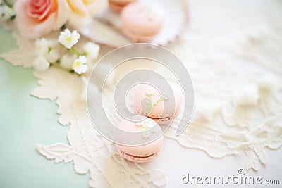 macarons and pearls on a lace tablecloth for elegance Stock Photo