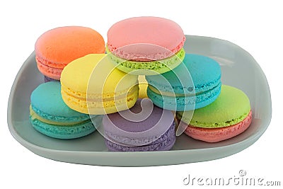 Macarons in plate isolated on white background. Stock Photo