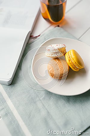 Macarons on white wooden background Stock Photo