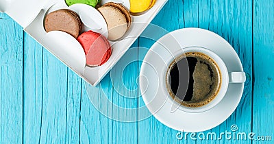 Macaroons with coffee on table Stock Photo