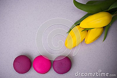 Macaroons food with tulips pink violet background for valentines mother woman day easter with love Stock Photo