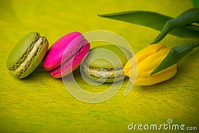 macaroons food with tulips yellow background for valentines mother woman day easter with love Stock Photo