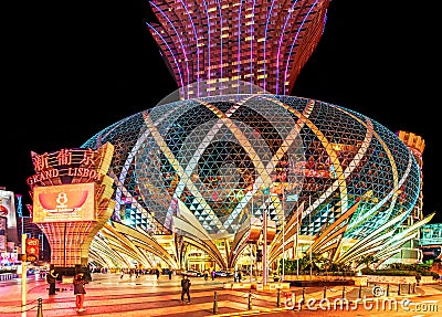 MACAU, CHINA. Grand Lisboa 5-star Hotel in Macau which is the gambling capital of Asia. Entrance view. Night Macao cityscape Editorial Stock Photo