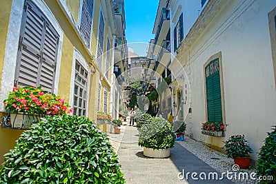 MACAU, CHINA- MAY 11, 2017: An unidentified people walking around of quiet and beautiful portuguese street in Macau city Editorial Stock Photo