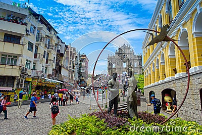 MACAU, CHINA- MAY 11, 2017: An unidentified people walking around of Ruins of Saint Paul`s Portuguese Cathedral attract Editorial Stock Photo