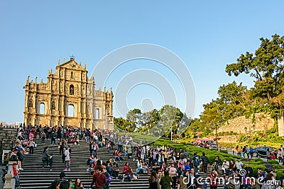 A crowd of tourists at the main sight of Macau - Ruins of Saint Paul`s Church Editorial Stock Photo