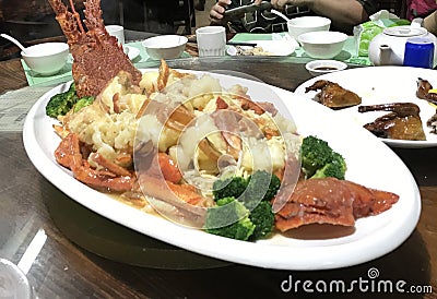 Macau Chinese Restaurant Baked Cheese Lobster Noodle Seafood Cuisine Dinner Vegetable Meat Protein Stock Photo