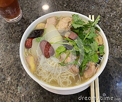 Macau Cuisine Herbal Chicken Soup Noodle broth Coriander Winter Melon Dates Fungus Macao Food Dish Local Deli Cantonese Cuisine Stock Photo