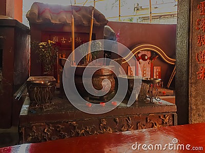 Taoist temple in Macau, with incense offerings Editorial Stock Photo