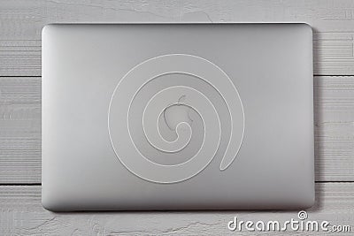 Macbook pro on wooden table Editorial Stock Photo