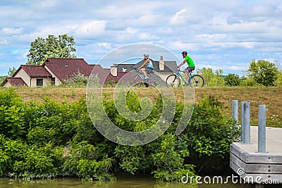 Bicyclists enjoy ride at the Erie Canal canal way trail in Upstate New York Editorial Stock Photo