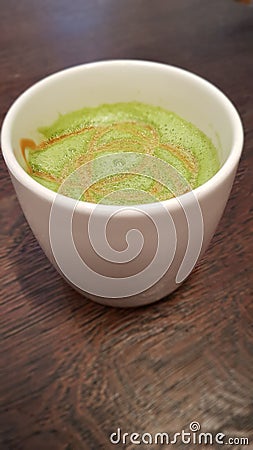 Macha latte in a white mug Stock Photo