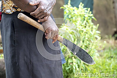 Machete in hand of native man Stock Photo